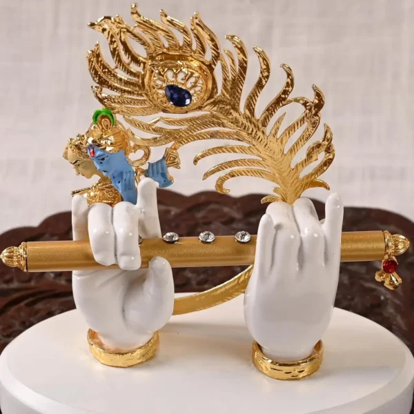 White & Golden Polyresin Gold Plated Krishna Hand With Face, Flute And Peacock Feather