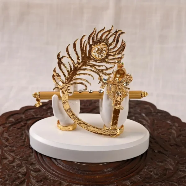 White & Golden Polyresin Gold Plated Krishna Hand With Face, Flute And Peacock Feather
